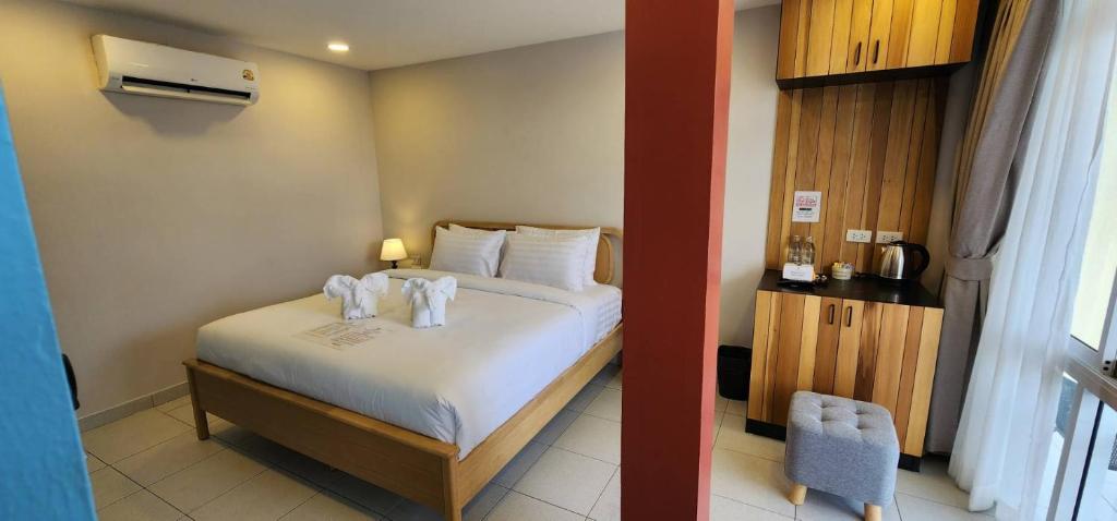Postel nebo postele na pokoji v ubytování Lenny's Koh Samui