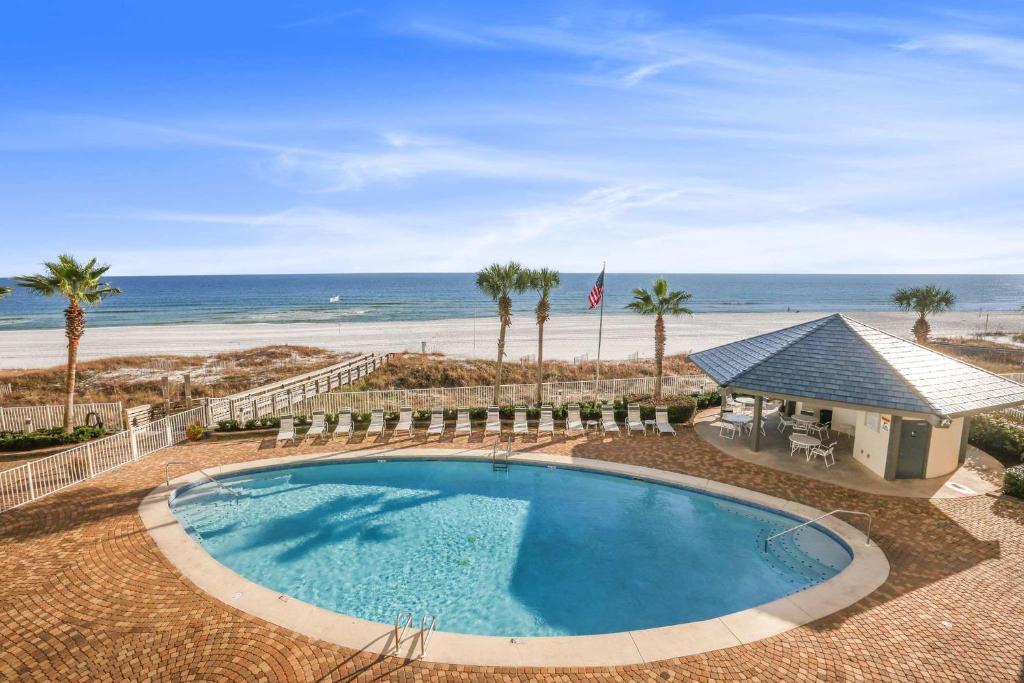 an overhead view of a swimming pool and the beach at Windward Pointe 1401-Large balcony best views in Orange Beach
