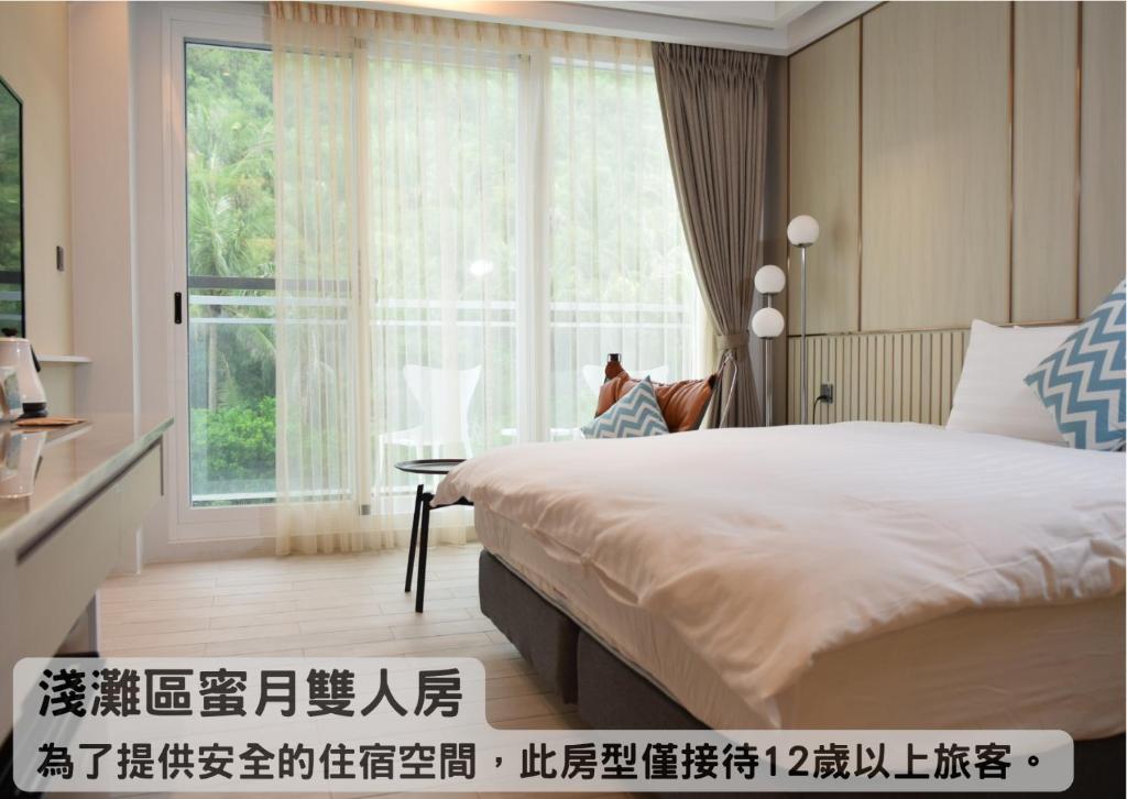 Tempat tidur dalam kamar di Hayata Hotel