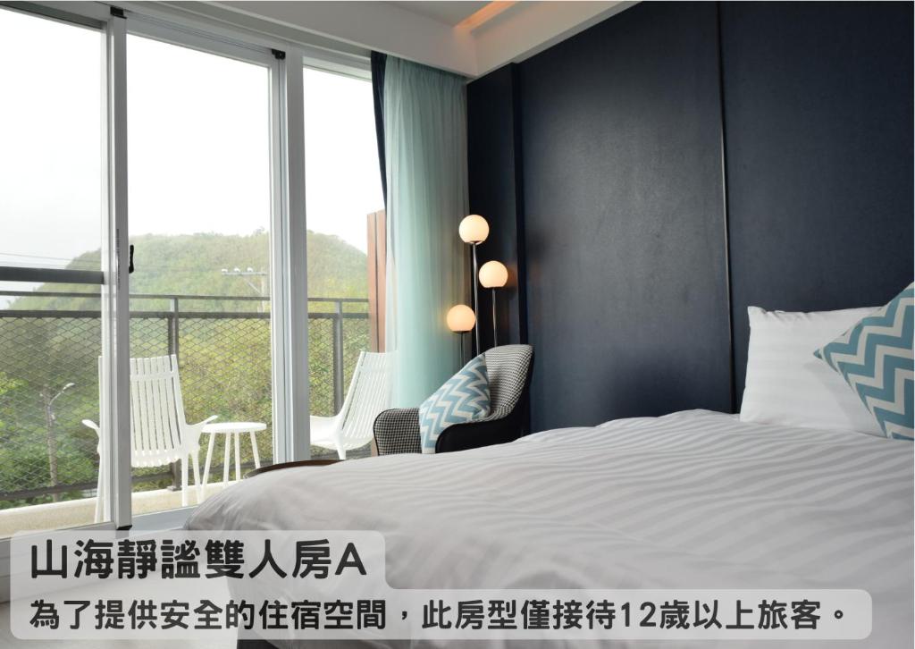 Tempat tidur dalam kamar di Hayata Hotel