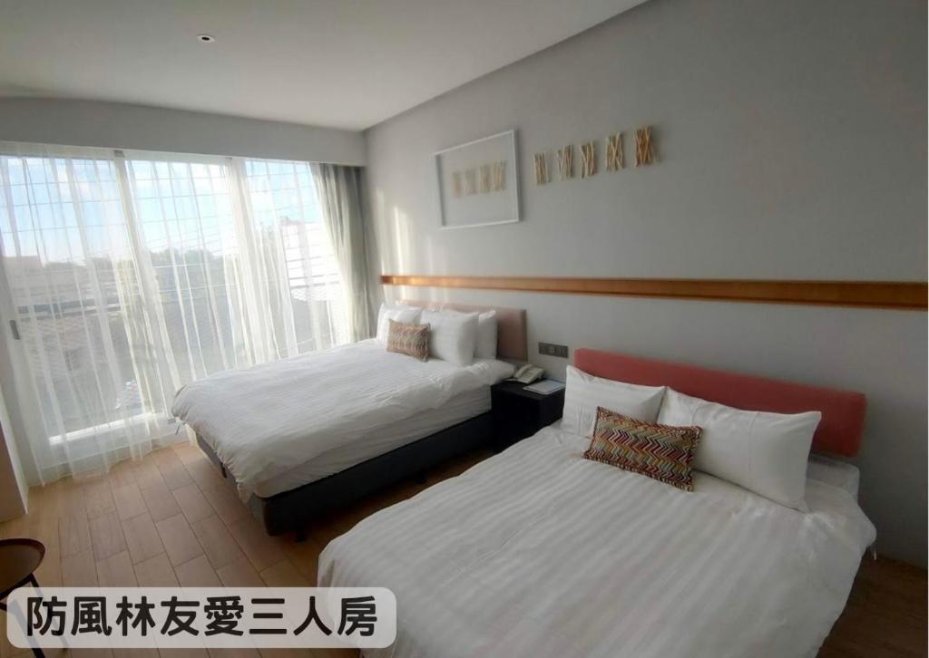 Tempat tidur dalam kamar di Hayata Hotel