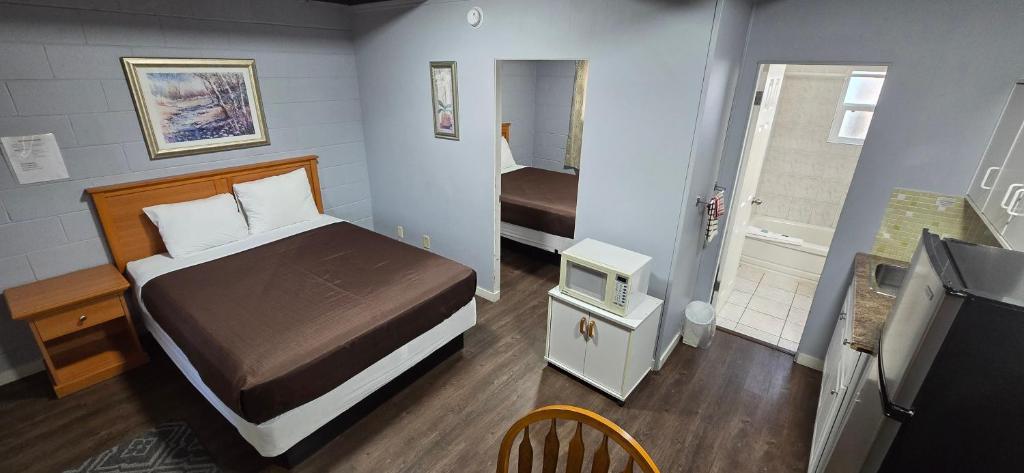 Postel nebo postele na pokoji v ubytování Flamingo Motel