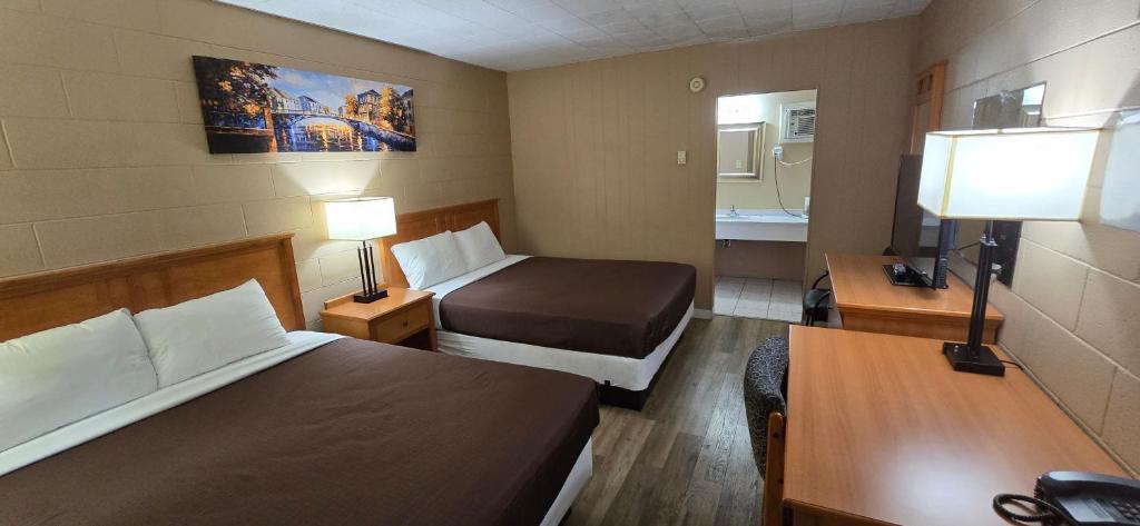 Postel nebo postele na pokoji v ubytování Flamingo Motel