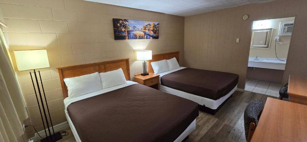 Postel nebo postele na pokoji v ubytování Flamingo Motel
