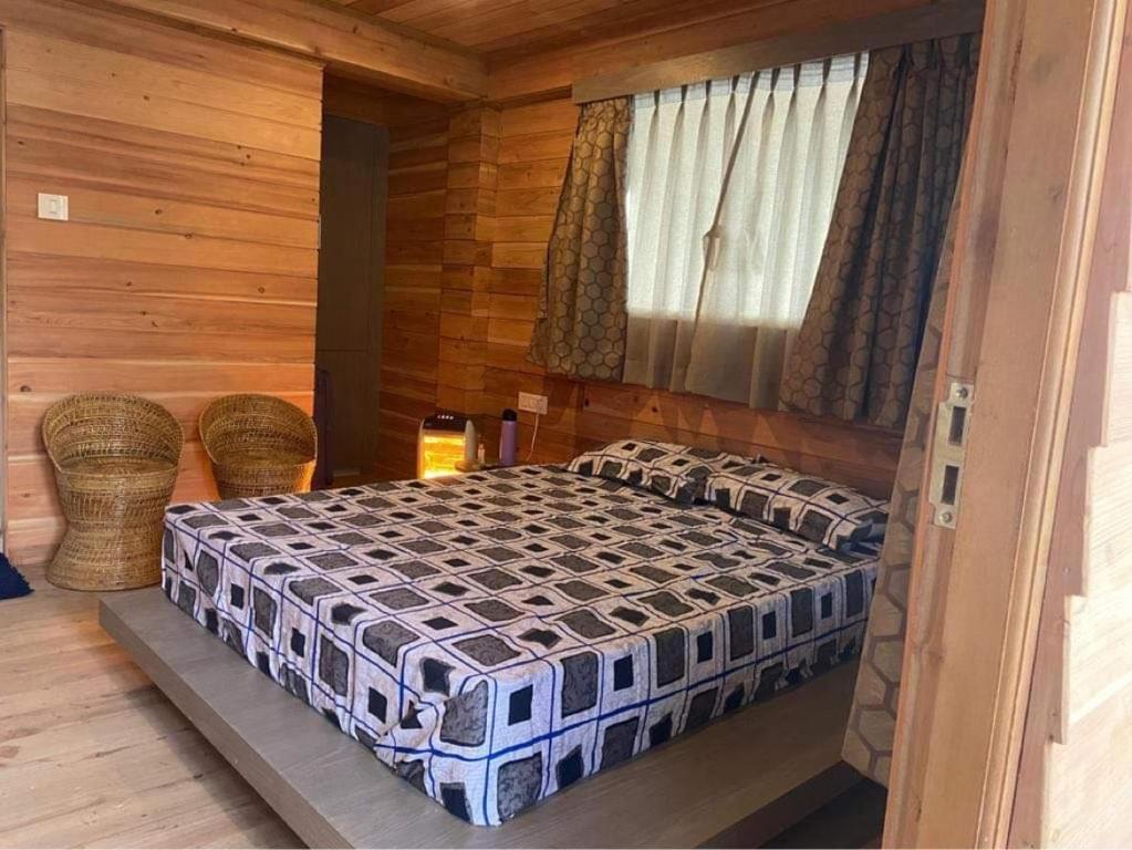 Postel nebo postele na pokoji v ubytování Norbu Thungkar Homestay