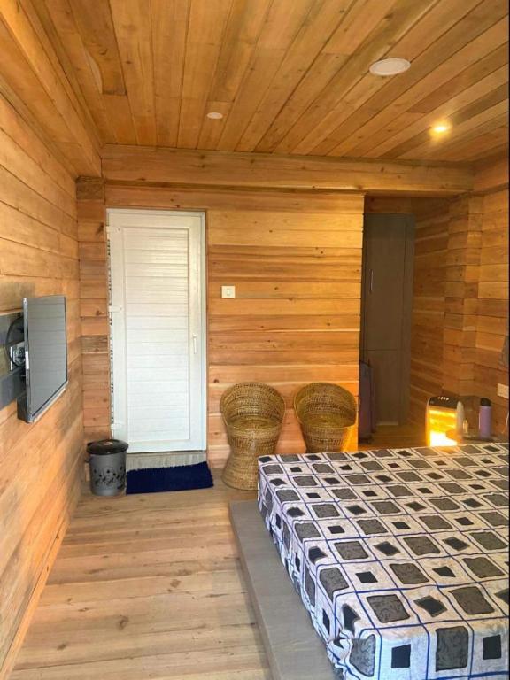 Postel nebo postele na pokoji v ubytování Norbu Thungkar Homestay