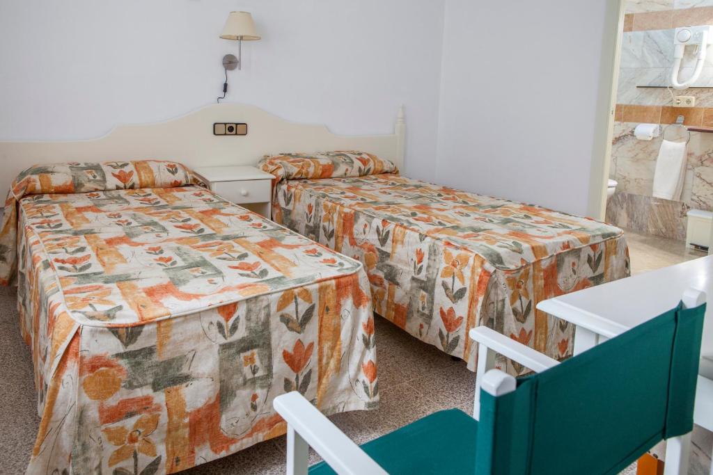 Postel nebo postele na pokoji v ubytování Hotel Agora