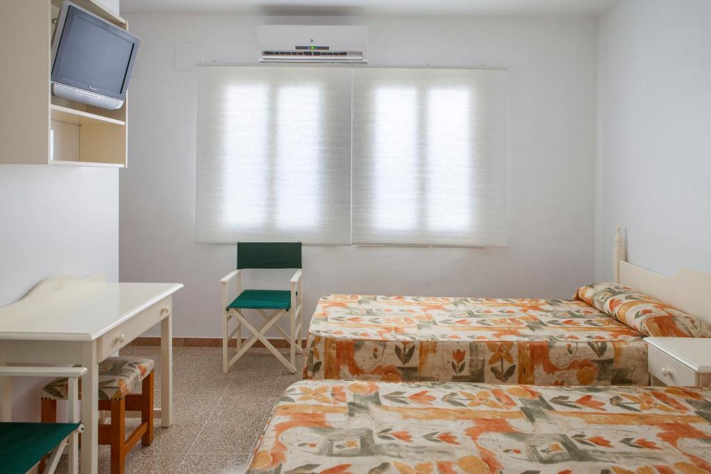Postel nebo postele na pokoji v ubytování Hotel Agora