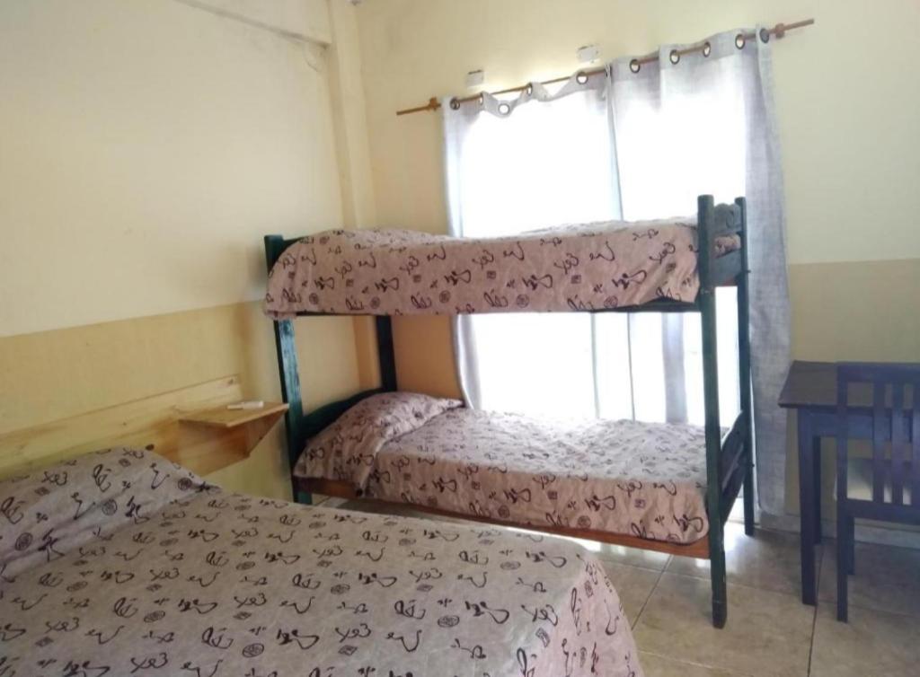 Postel nebo postele na pokoji v ubytování Sweet Guest House