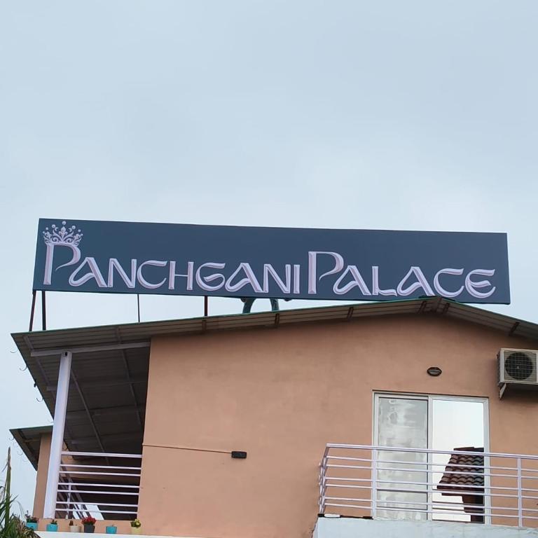 a sign on the top of a building at Panchgani Palace in Panchgani
