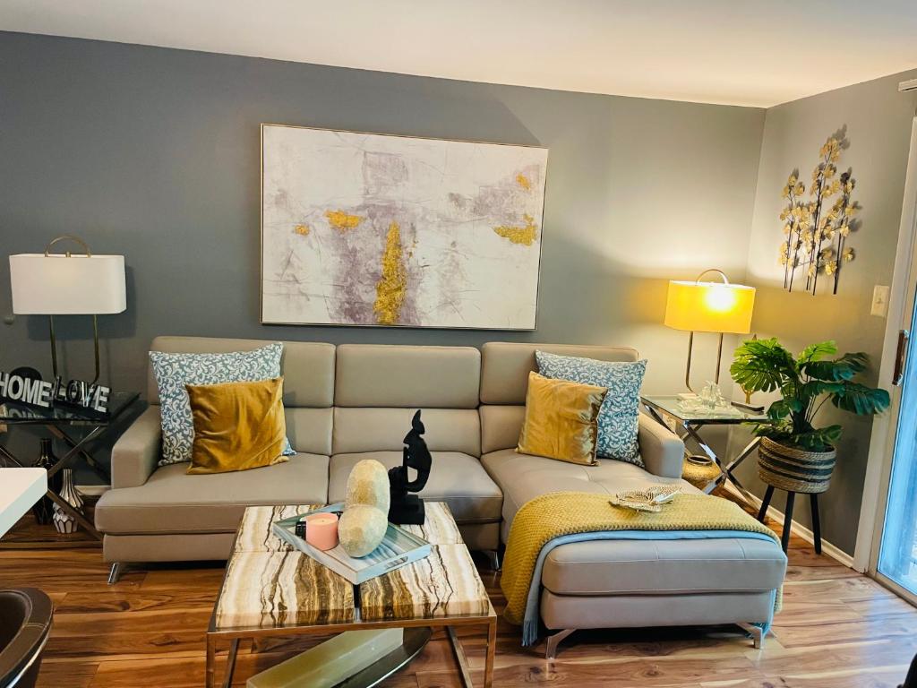 a living room with a couch and a table at Welcome Home in Hyattsville