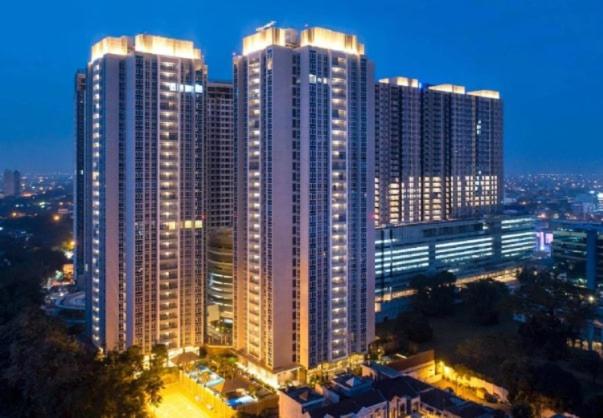 a city skyline with tall buildings at night at Apartment - 2 bedroom, 3 beds in Medan