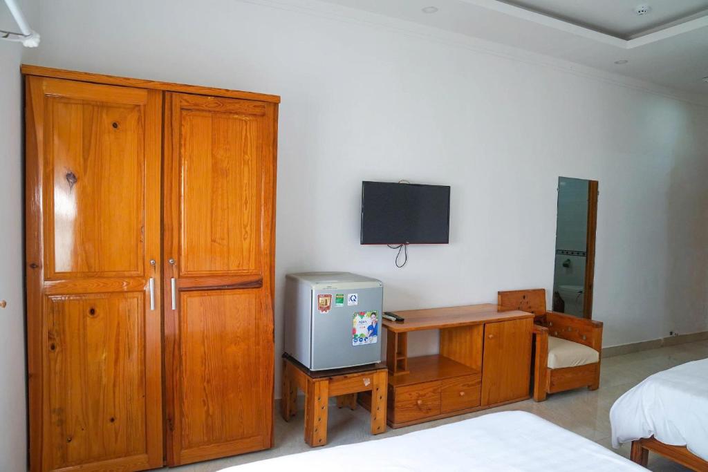 TV a/nebo společenská místnost v ubytování Lotus Hotel & Café