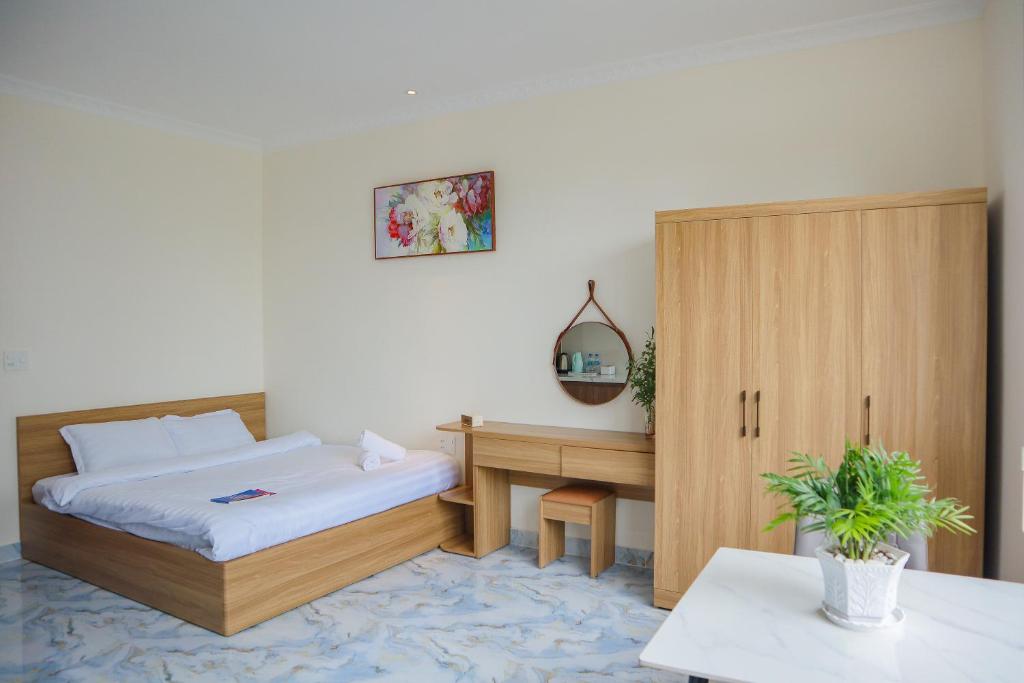 Postel nebo postele na pokoji v ubytování Hamia Boutique Hotel managed by Marcom Jack Lee