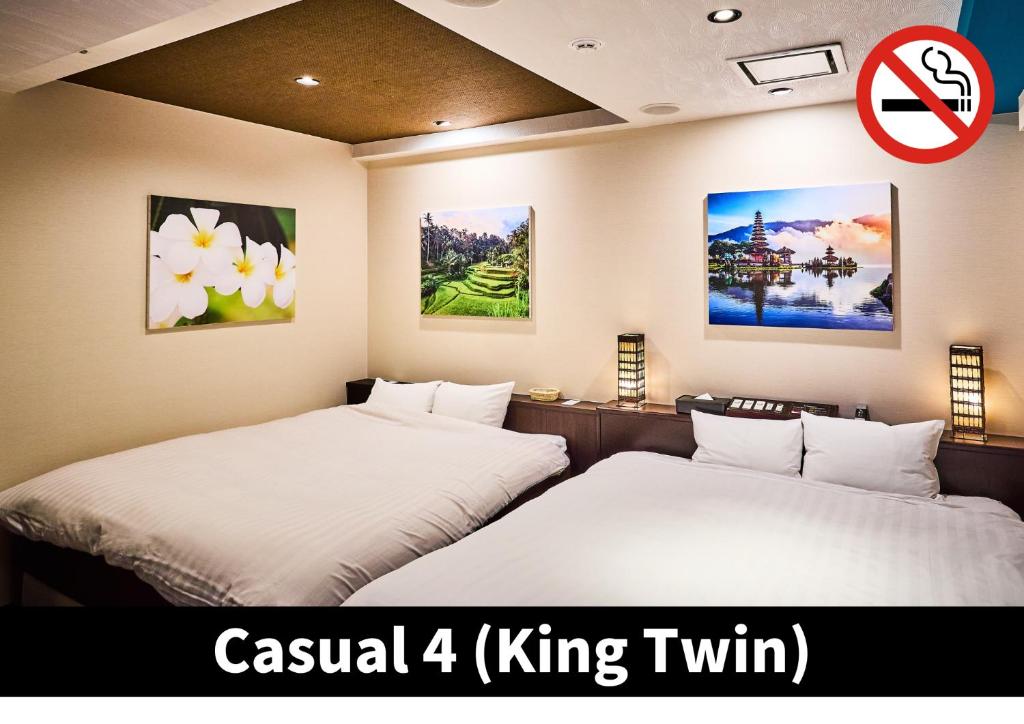 Postel nebo postele na pokoji v ubytování Hotel K6 Osaka Namba