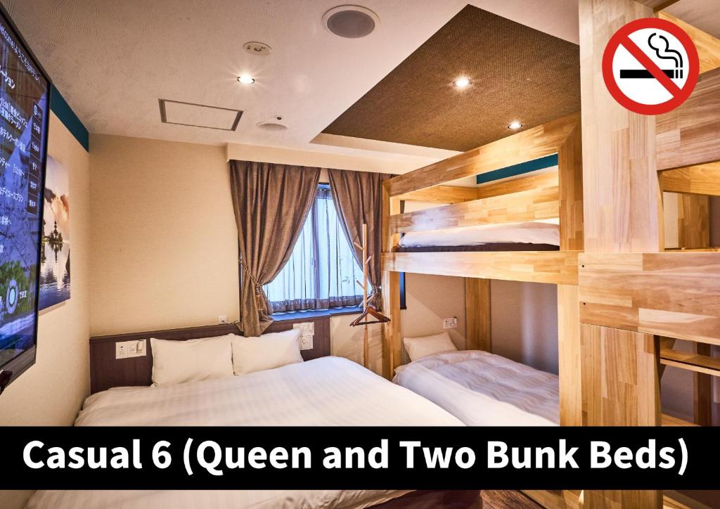 Postel nebo postele na pokoji v ubytování Hotel K6 Osaka Namba