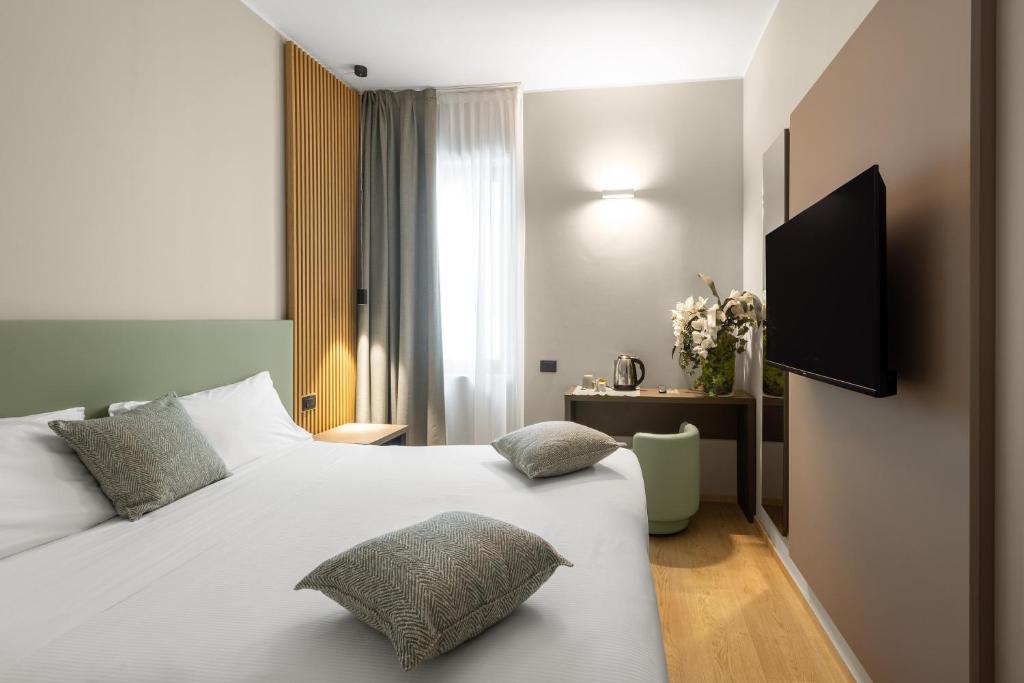 Postel nebo postele na pokoji v ubytování Energy Park Hotel