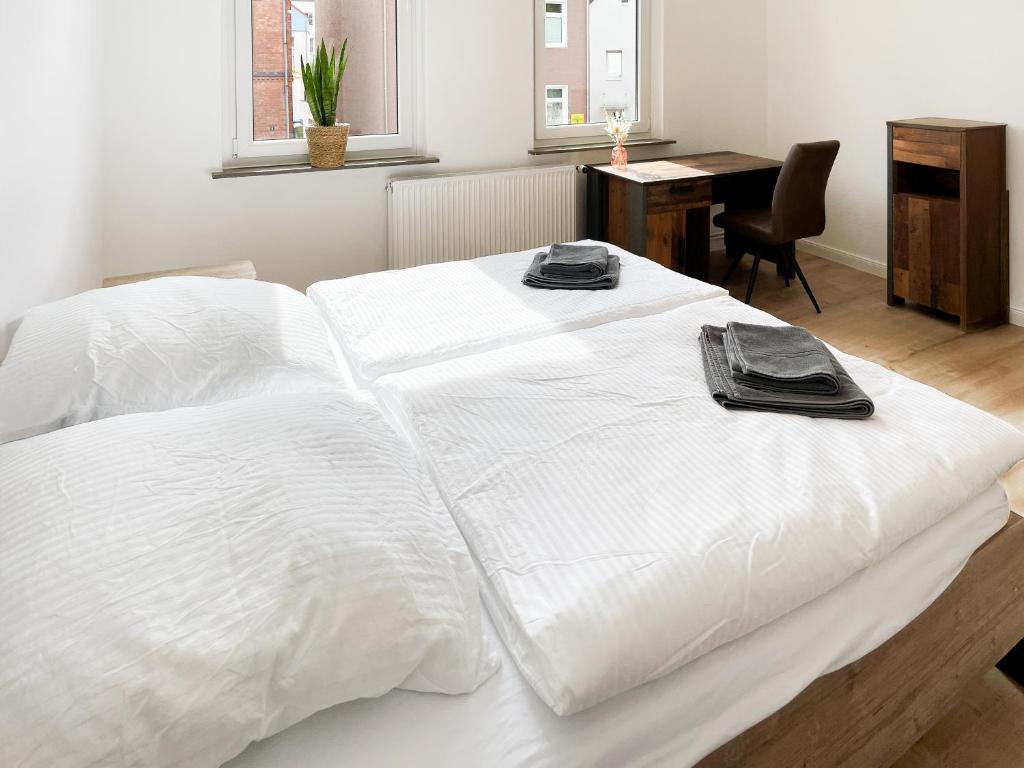 Postel nebo postele na pokoji v ubytování BRIGHT Elzer Straße