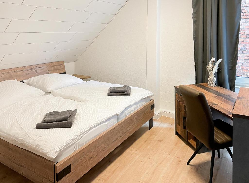 Postel nebo postele na pokoji v ubytování BRIGHT Elzer Straße