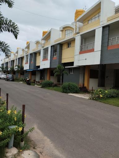 an empty street with a row of apartment buildings at Royalpark resort in Jāmb