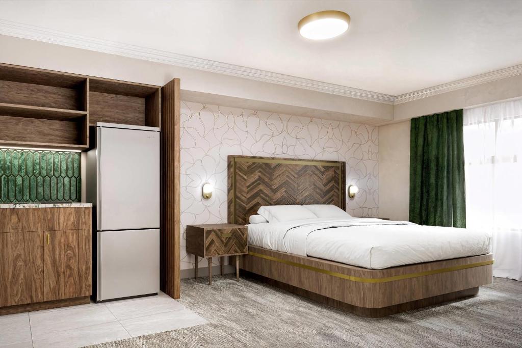 Postel nebo postele na pokoji v ubytování Velora Hinton, Ascend Hotel Collection
