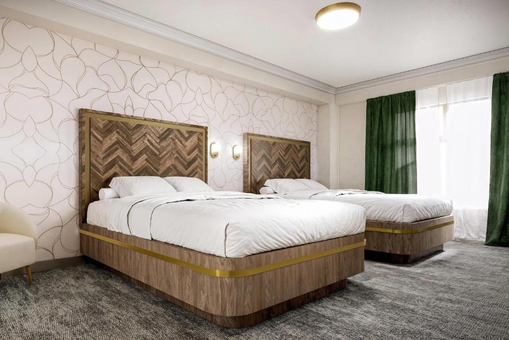 Postel nebo postele na pokoji v ubytování Velora Hinton, Ascend Hotel Collection
