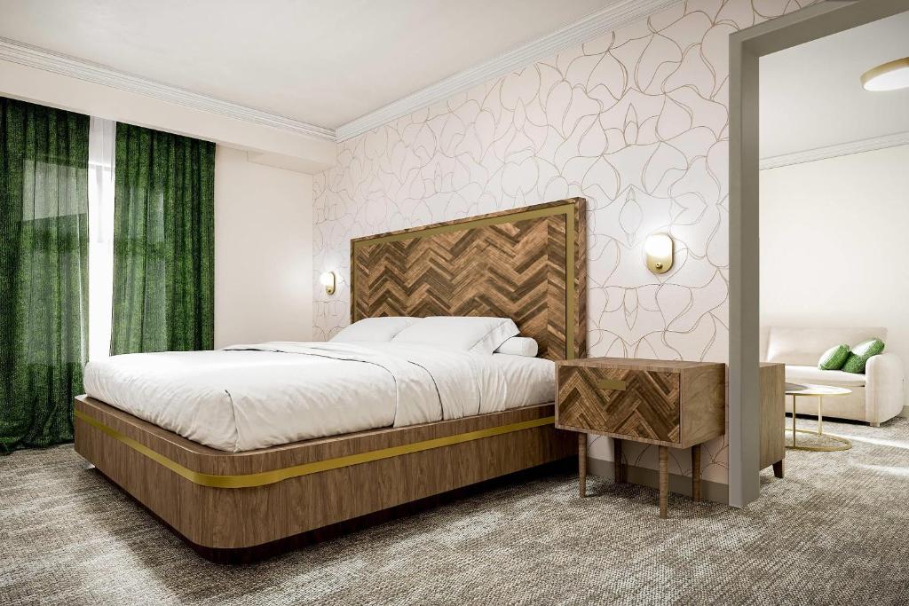 Postel nebo postele na pokoji v ubytování Velora Hinton, Ascend Hotel Collection