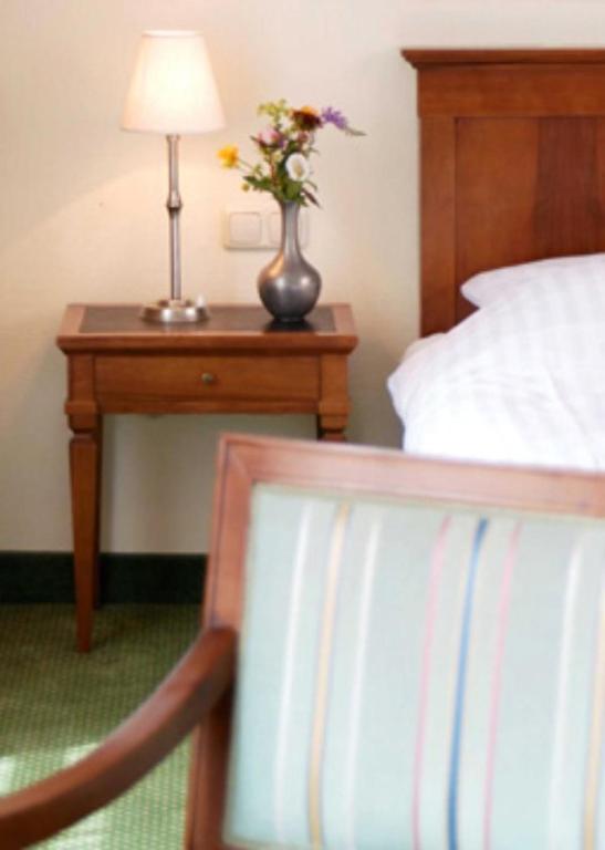 Postel nebo postele na pokoji v ubytování Hotel Deutsches Theater Stadtzentrum