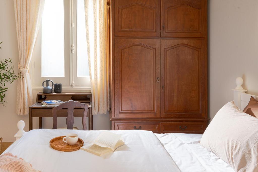 Postel nebo postele na pokoji v ubytování Éclectique Hanoi Homestay