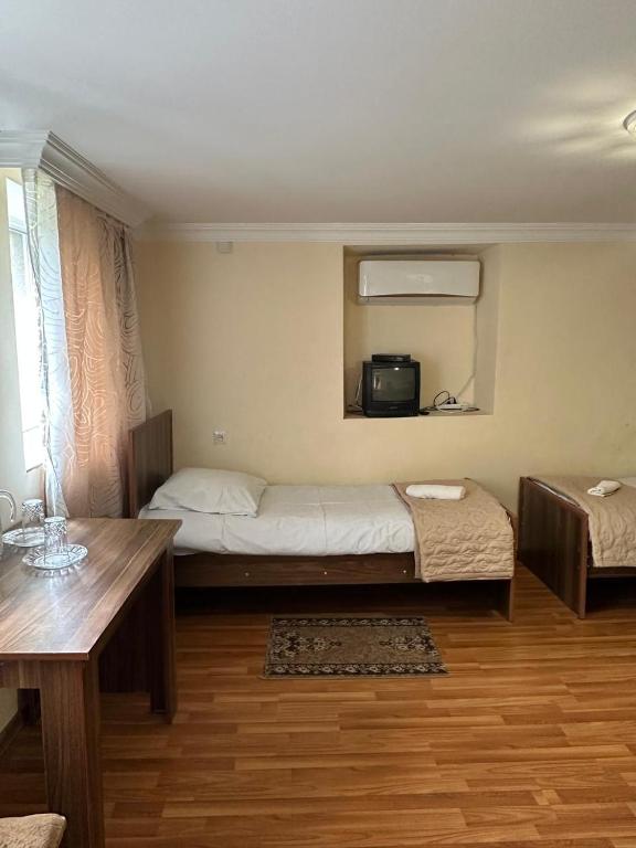 Postel nebo postele na pokoji v ubytování Nunu's Guesthouse