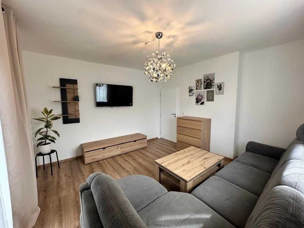TV a/nebo společenská místnost v ubytování RingRooms - Self Check-In