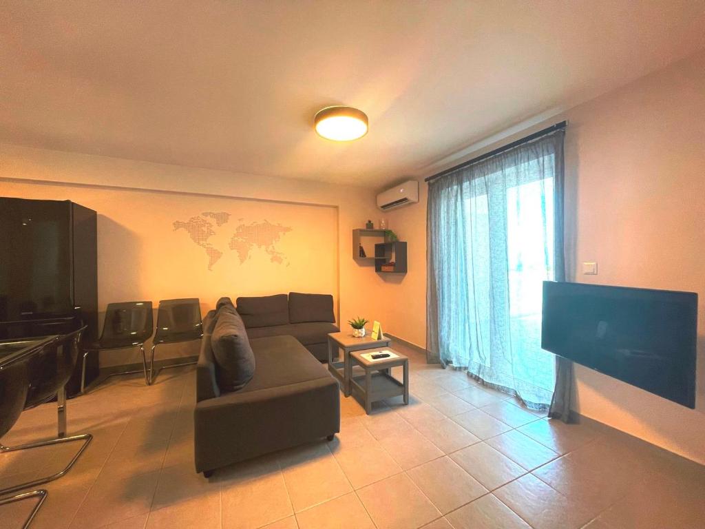 Televízia a/alebo spoločenská miestnosť v ubytovaní Fedra - Panoramic Sea View