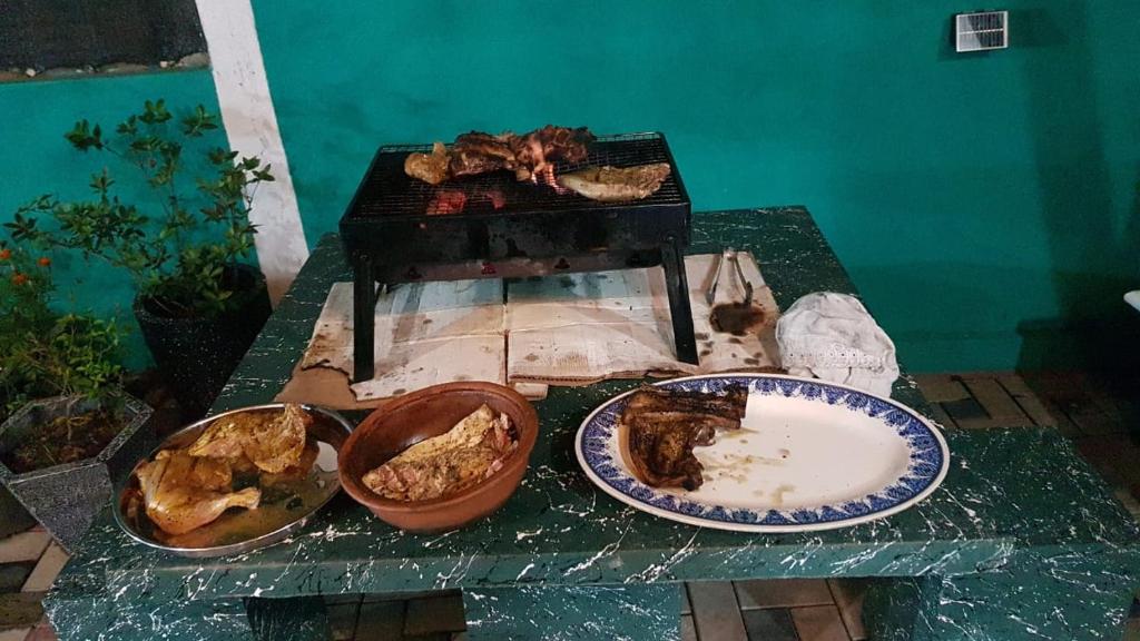 a table with two plates of food on it at Family Home in Sharjah