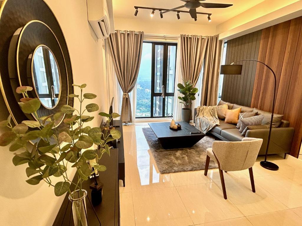 a living room with a couch and a table at KL Central 32 Floor KLCC View in Kuala Lumpur