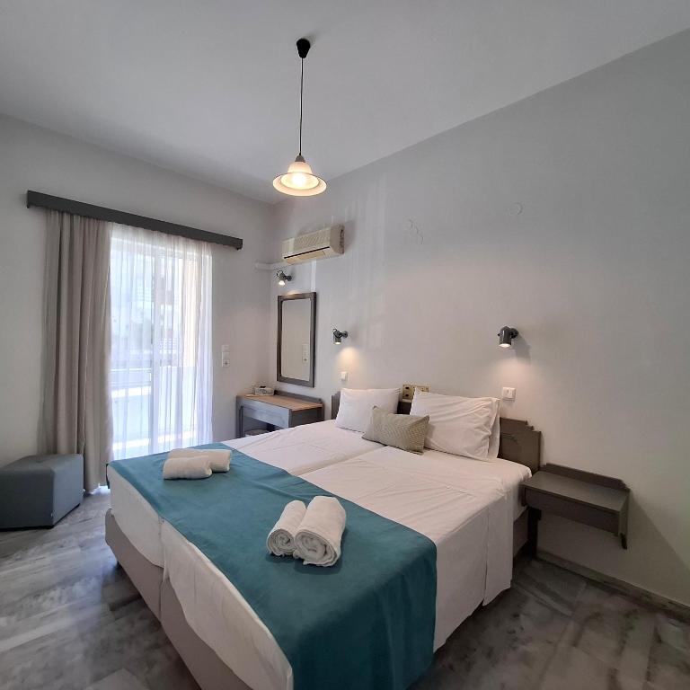 Postel nebo postele na pokoji v ubytování Mardinik Hotel Apartments