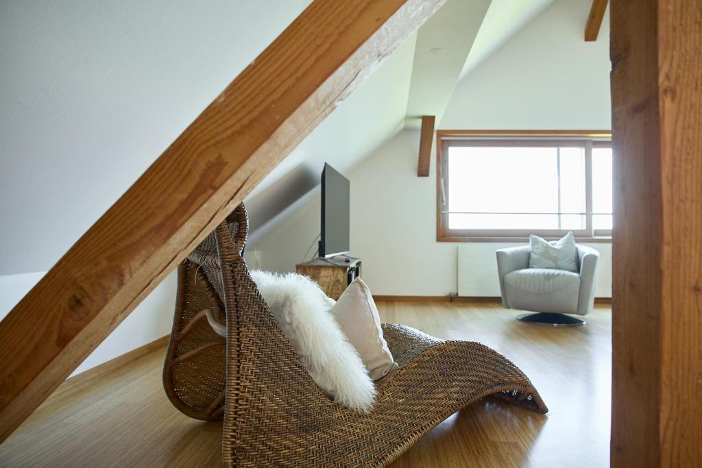 Posezení v ubytování Außergewöhnliches Loft am Pfänderhang mit Seeblick