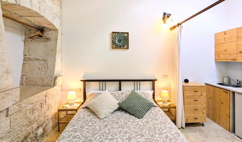 Llit o llits en una habitació de Trulli Panoramici