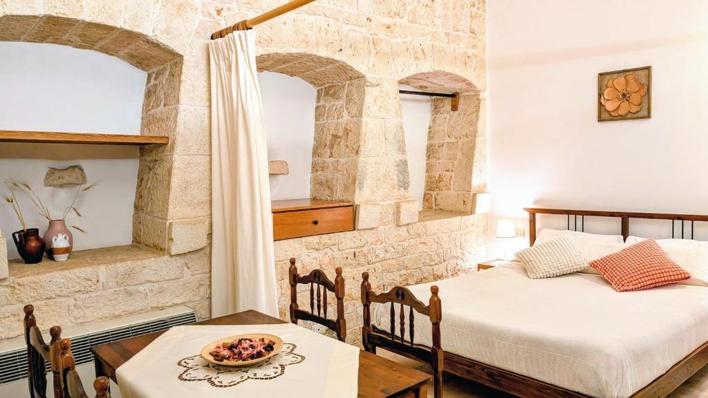 Llit o llits en una habitació de Trulli Panoramici