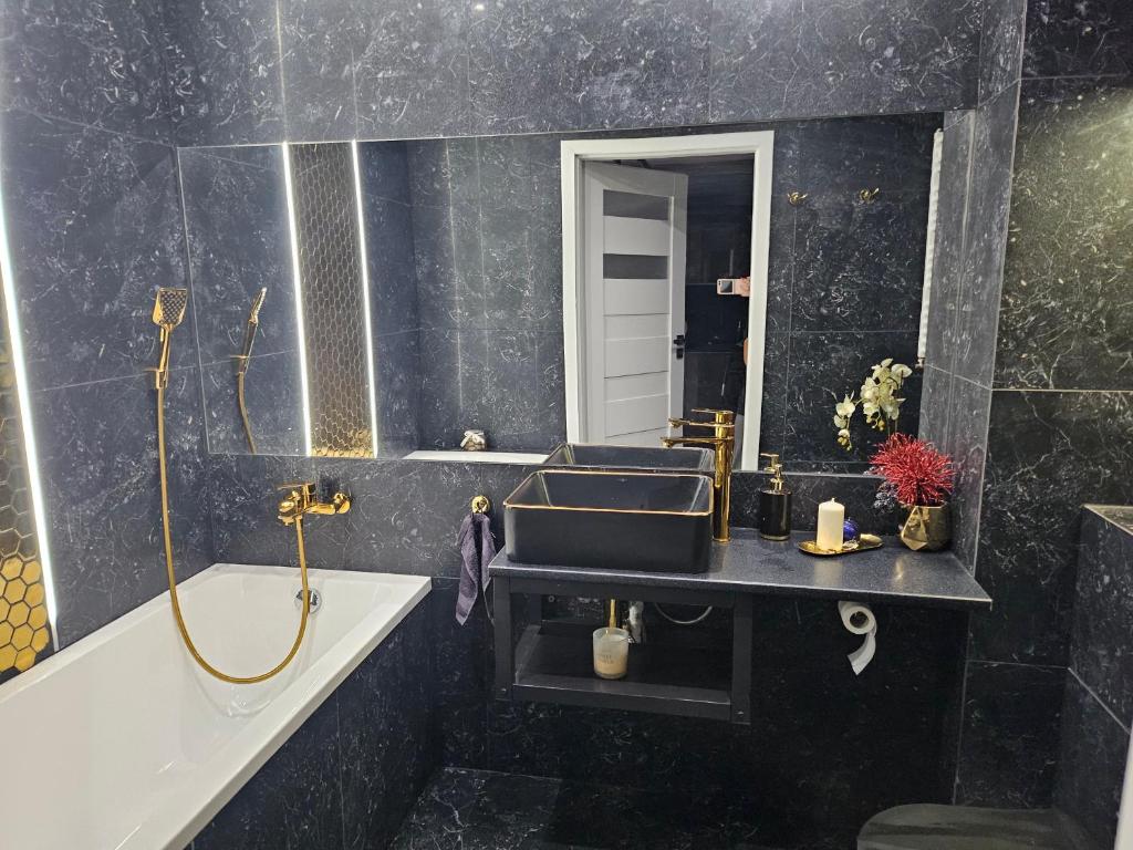 Kúpeľňa v ubytovaní Przytulny apartament