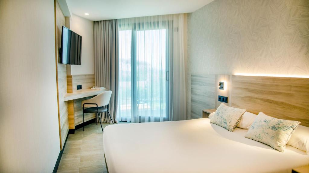 Postel nebo postele na pokoji v ubytování Hotel Delfin Azul