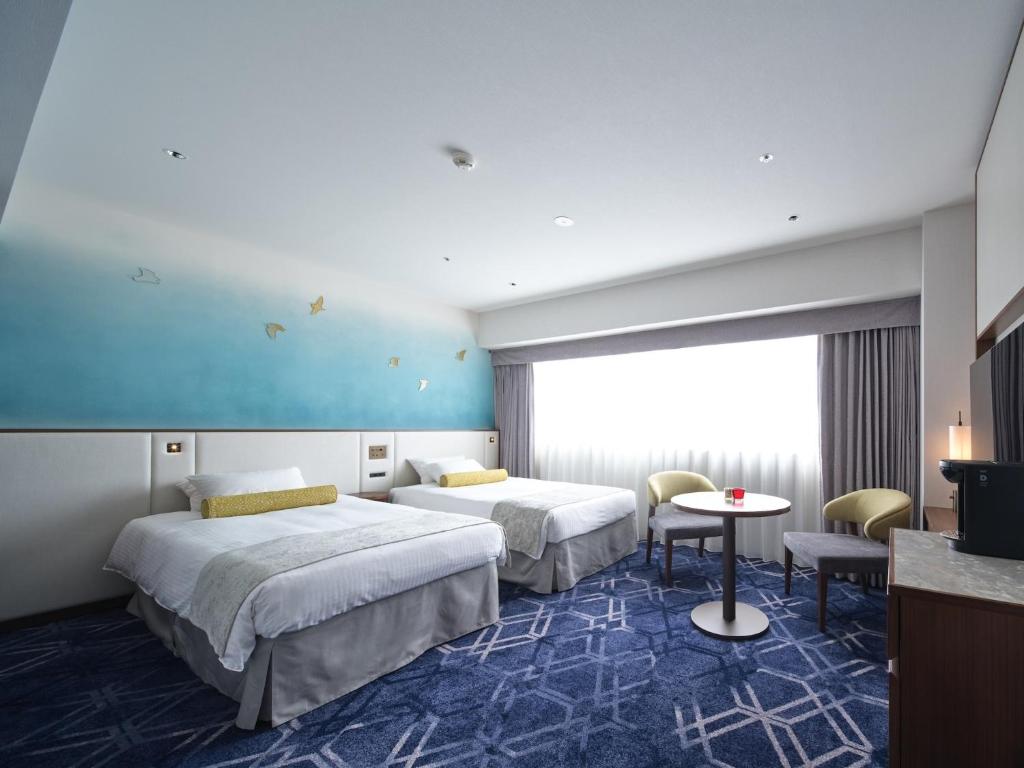 Postel nebo postele na pokoji v ubytování Hotel Nikko Himeji