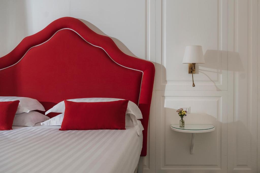 Postel nebo postele na pokoji v ubytování Hotel Savoia