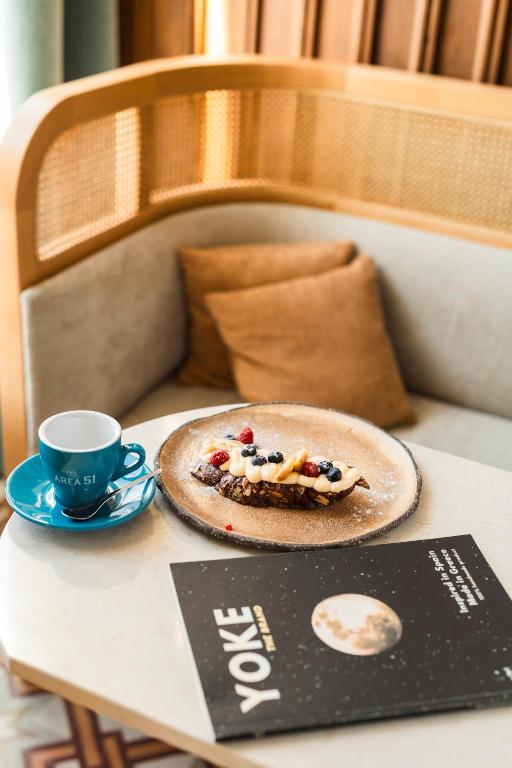 a plate of food on a table with a cup of coffee at ON Residence - Small Luxury Hotels of the World in Thessaloniki