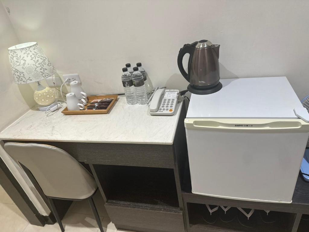 A kitchen or kitchenette at Tilon Hotel
