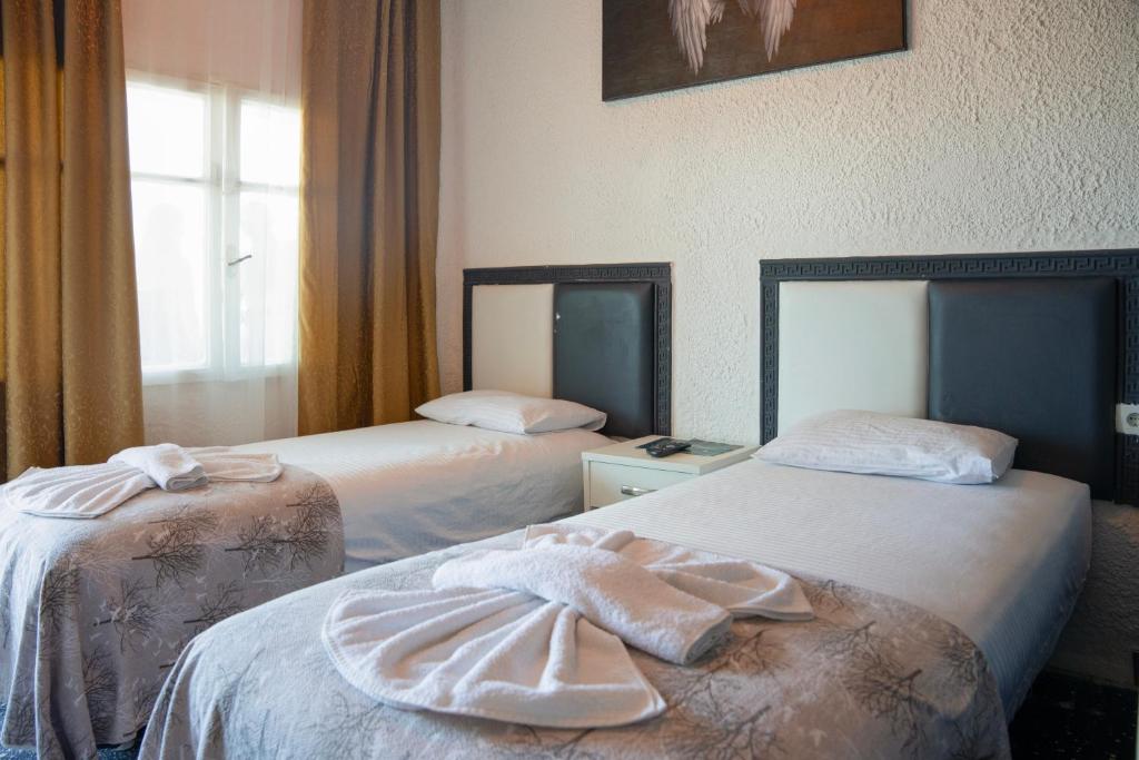 Postel nebo postele na pokoji v ubytování İMREN'S OTEL