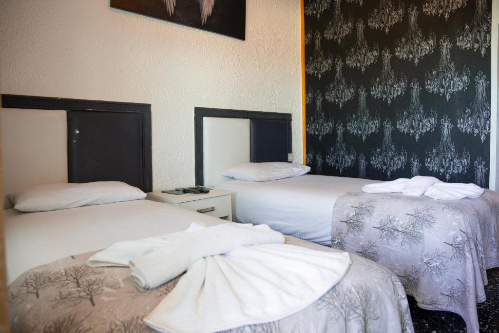Postel nebo postele na pokoji v ubytování İMREN'S OTEL