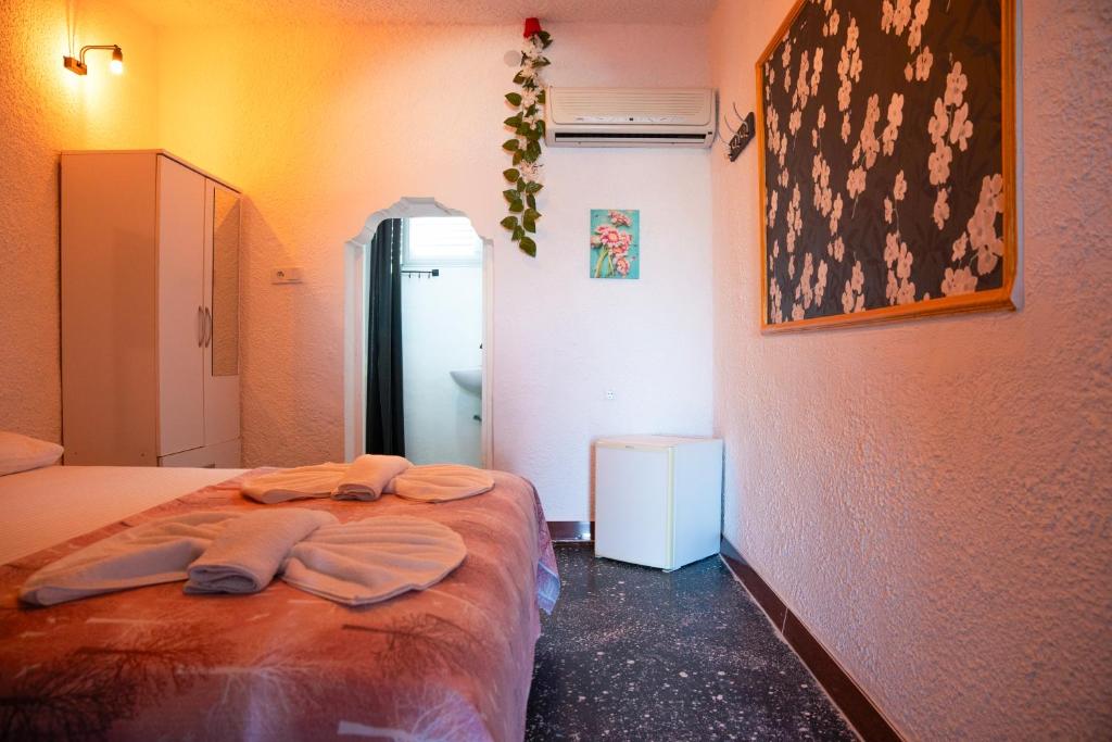 Postel nebo postele na pokoji v ubytování İMREN'S OTEL