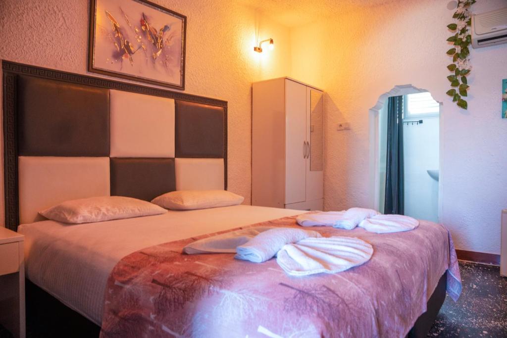 Postel nebo postele na pokoji v ubytování İMREN'S OTEL