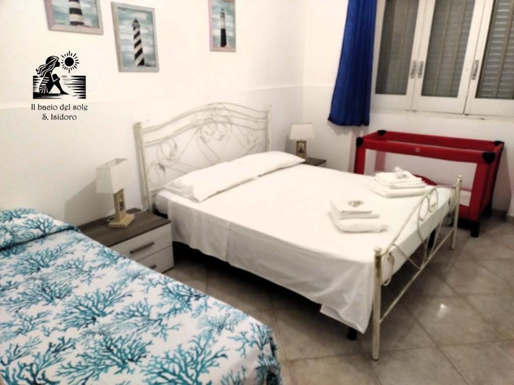 Postel nebo postele na pokoji v ubytování Il bacio del sole - S. Isidoro