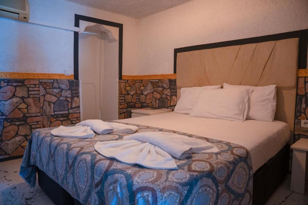 Postel nebo postele na pokoji v ubytování İMREN'S OTEL